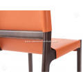 Orange saddle leather armless dining chairs